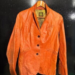 Distressed vintage 90’s burnt orange leather jacket by Kuhlman made in Pakistan